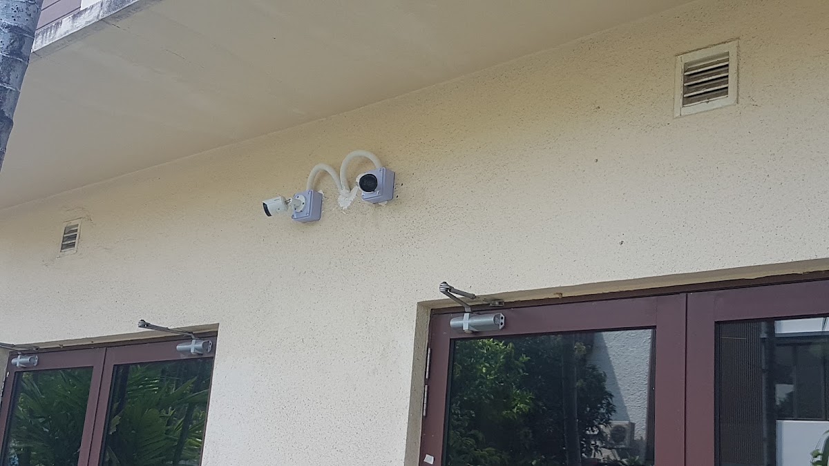 Two CCTV cameras with conduit newly mounted on an exterior wall